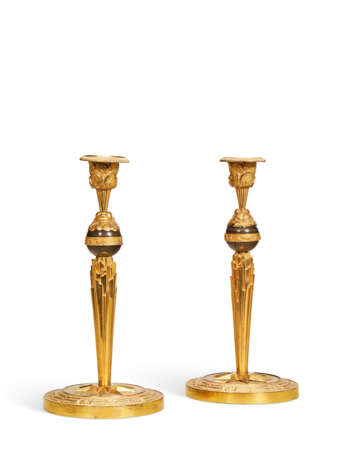 A PAIR OF CONSULAT ORMOLU AND PATINATED-BRONZE CANDLESTICKS - photo 1