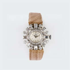 Bucherer. Damen-Armbanduhr mit Diamantbesatz.