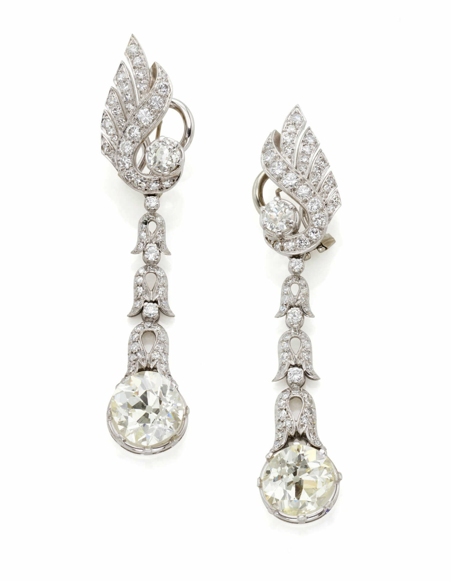 Diamond, white gold and platinum earrings accented…