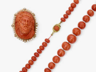 A brooch with coral gem depicting Bacchus. Italy, 18th century. Contemporary setting