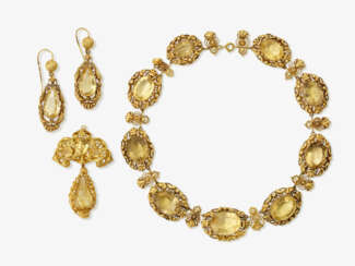 A necklace, pendant/brooch and a pair of drop earrings with citrines. Germany, circa 1850