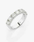 Hand jewellery. A classic eternity ring decorated with very fine white brilliant-cut diamonds. Belgium, ONLY JEWELS