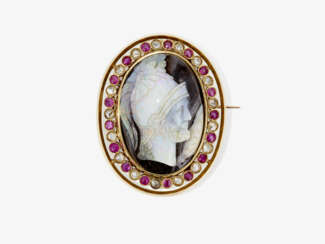 A brooch with opal gem, diamonds and rubies. Circa 1860