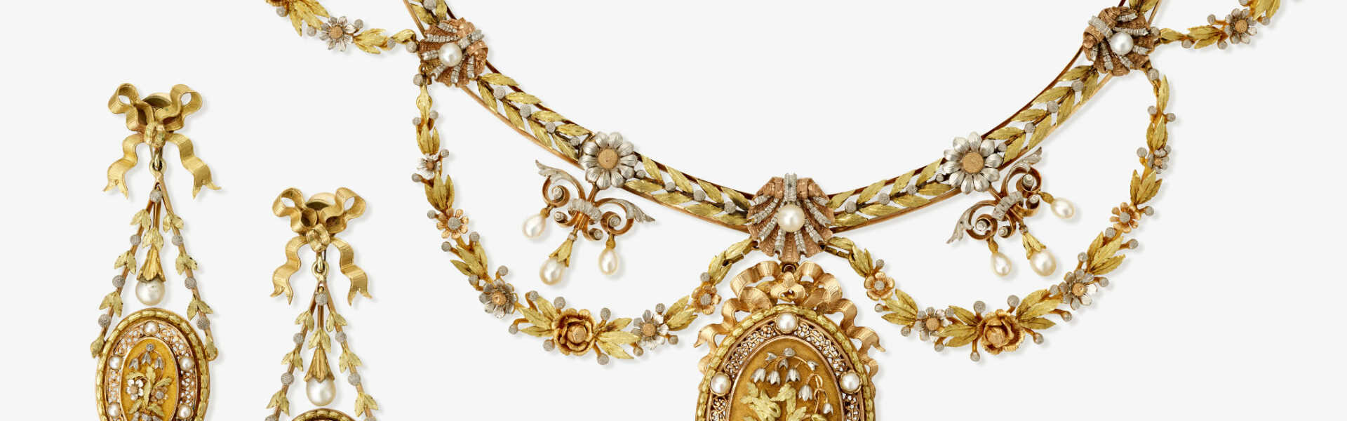 A parure consisting of a necklace and a pair of drop earrings in tricolour gold with small pearls. Paris, circa 1880