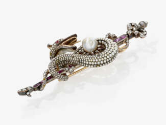 A brooch depicting a snake with diamonds, rubies and seed pearls. Probably England, circa 1880 - 1890