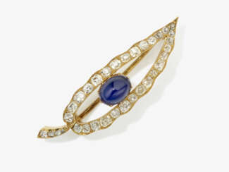 A leaf brooch with sapphire cabochon and diamonds. Probably England, early 20th century