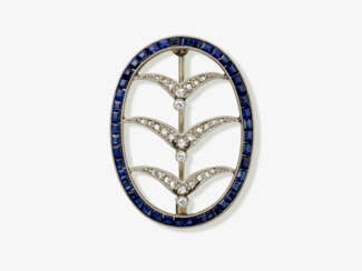 An oval brooch with diamonds and sapphires. Probably England or Germany, circa 1920