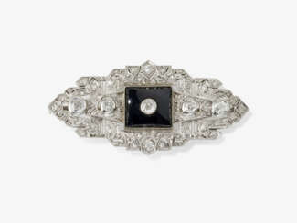 A brooch with onyx and diamonds. Probably Germany, 1930s