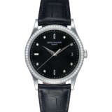 PATEK PHILIPPE REF. 5297G-001, AN ATTRACTIVE GOLD AND DIAMOND-SET WRISTWATCH WITH A BLACK DIAMOND-SET DIAL - photo 1