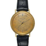 PATEK PHILIPPE, REF. 3569, AN ATTRACTIVE 18k GOLD AUTOMATIC WRISTWATCH WITH A MATCHING TEXTURED BEZEL AND DIAL - photo 1