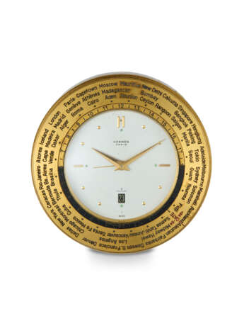 HERMES, A RARE GILT BRASS MANUAL-WINDING WORLDTIME DESK CLOCK - photo 1