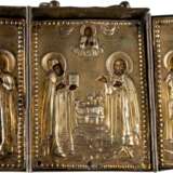 A SMALL TRIPTYCH SHOWING PATRON SAINTS WITH SILVER-GILT OKLADS - photo 1