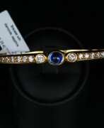 Overview. Gold bracelet with diamonds and sapphires