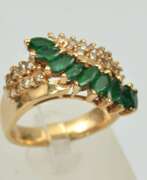 Product catalog. Gold ring with emeralds and diamonds