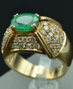 Overview. Yellow gold ring with 48 diamonds and 1 natural emerald