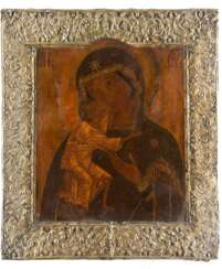 AN ICON SHOWING THE FEODOROVSKAYA MOTHER OF GOD WITH SILVER-GILT BASMA