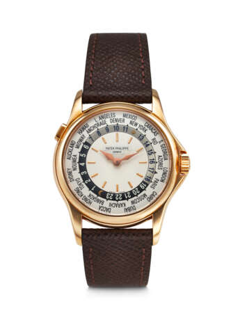 PATEK PHILIPPE. AN ATTRACTIVE 18K PINK GOLD AUTOMATIC WORLD TIME WRISTWATCH - Foto 1