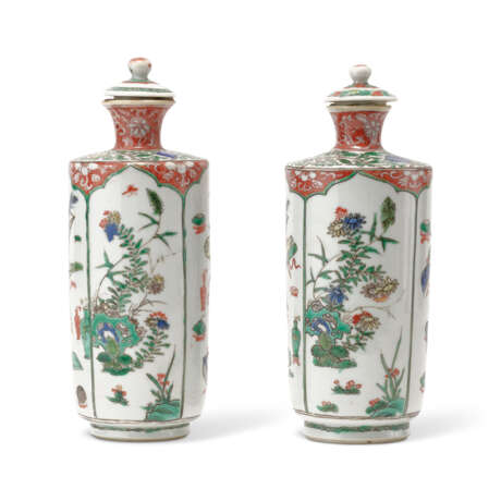 TWO GILT-DECORATED FAMILLE VERTE CYLINDRICAL ‘FLOWER AND ANTIQUES’ VASES AND COVERS - фото 1