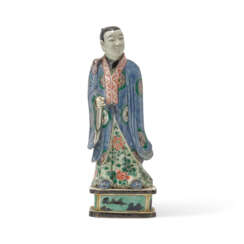 A BISCUIT-ENAMELLED FIGURE OF AN ATTENDANT