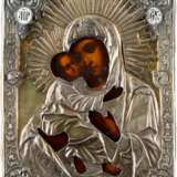 AN ICON SHOWING THE VLADIMIRSKAYA MOTHER OF GOD WITH SILVER-GILT OKLAD - фото 1