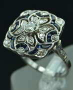 Overview. Platinum art-deco style ring with diamonds and sapphires