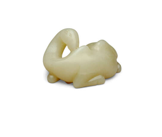 A SMALL PALE CELADON JADE CARVING OF A RECUMBENT CAMEL - photo 1