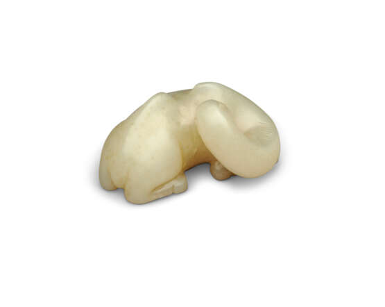 A SMALL PALE CELADON JADE CARVING OF A RECUMBENT CAMEL - photo 2