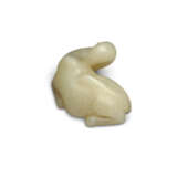 A SMALL PALE CELADON JADE CARVING OF A RECUMBENT CAMEL - photo 3