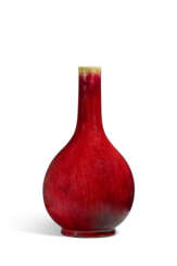 A RED-GLAZED BOTTLE VASE