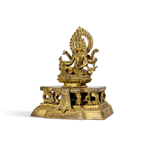 AN INSCRIBED GILT-BRONZE FIGURE OF SEATED VASUDHARA - photo 2