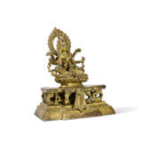 AN INSCRIBED GILT-BRONZE FIGURE OF SEATED VASUDHARA - photo 3