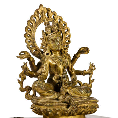 AN INSCRIBED GILT-BRONZE FIGURE OF SEATED VASUDHARA - photo 6