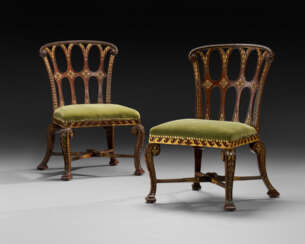 A PAIR OF GEORGE II MAHOGANY AND PARCEL-GILT CHAIRS