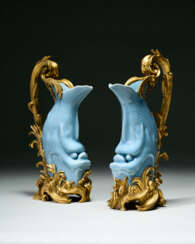 A PAIR OF LOUIS XV ORMOLU-MOUNTED CHINESE PORCELAIN CLAIR DE LUNE CARP EWERS