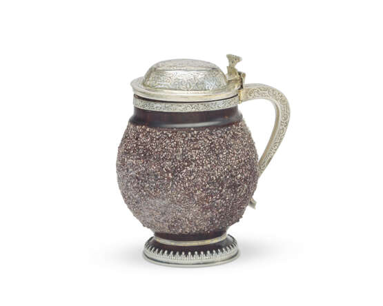 A CONTINENTAL SILVER-GILT MOUNTED STONEWARE TANKARD - photo 1