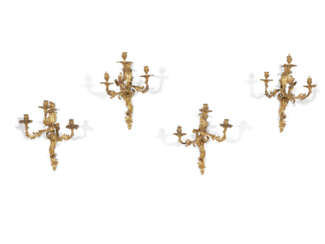 A MATCHED SET OF FOUR LOUIS XV ORMOLU THREE-BRANCH WALL-LIGHTS