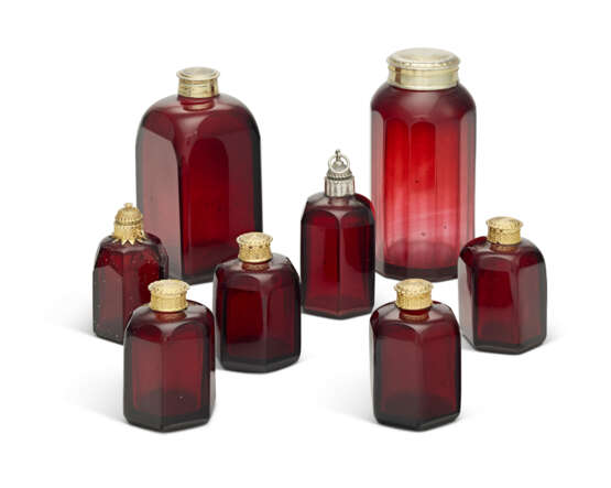 A GROUP OF EIGHT GERMAN SILVER AND SILVER-GILT MOUNTED RUBY GLASS BOTTLES AND COVERS - photo 1