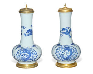 A PAIR OF REGENCE ORMOLU-MOUNTED CHINESE PORCELAIN BLUE AND WHITE VASES AND COVERS