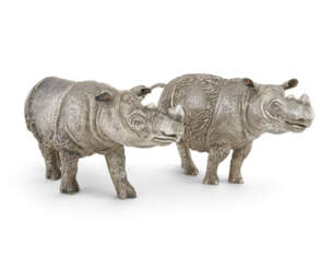 TWO ELIZABETH II SILVER FIGURES OF RHINOCEROSES