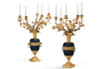 A PAIR OF RESTAURATION ORMOLU AND BLUED METAL FIVE-LIGHT CANDELABRA