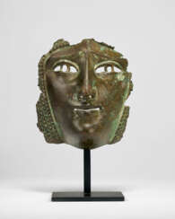 A ROMAN COPPER ALLOY MASK FROM A CAVALRY SPORT OR PARADE HELMET