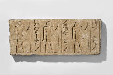 AN EGYPTIAN LIMESTONE RELIEF FOR IDU