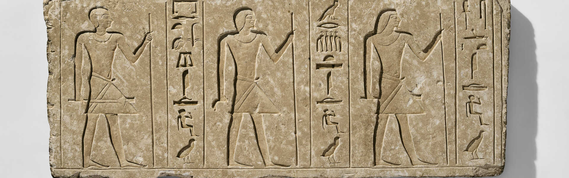 AN EGYPTIAN LIMESTONE RELIEF FOR IDU