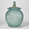 A ROMAN GLASS LIDDED CINERARY URN - Now at the auction