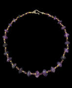 Neck jewellery. AN EGYPTIAN AMETHYST BEAD NECKLACE