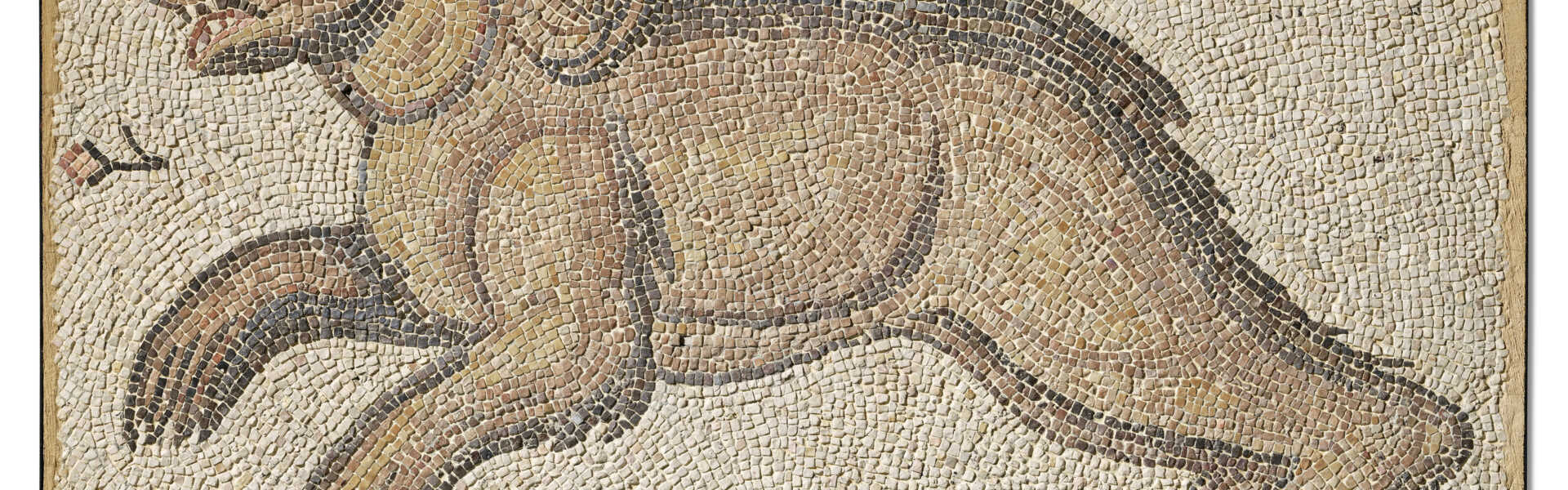 A LATE ROMAN MARBLE MOSAIC PANEL WITH A CHARGING BEAR