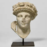 A ROMAN MARBLE ARCHAISTIC HEAD OF A DEITY - photo 1