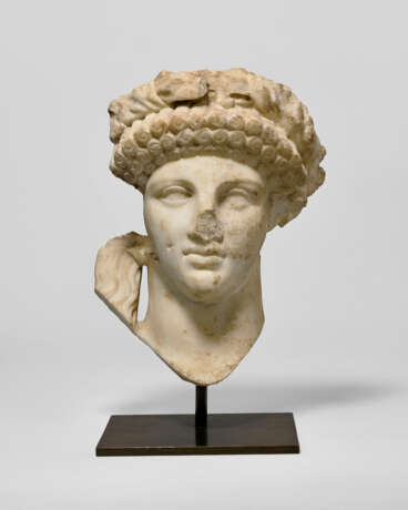 A ROMAN MARBLE ARCHAISTIC HEAD OF A DEITY - photo 1