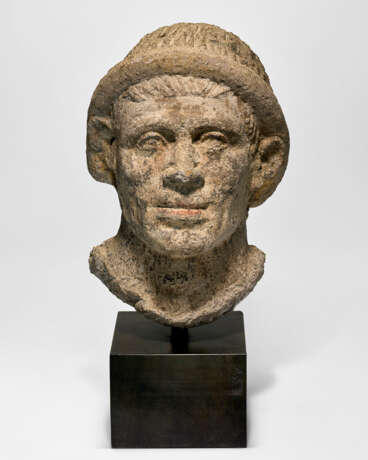 AN ETRUSCAN NENFRO PORTRAIT HEAD OF A MAN - photo 1