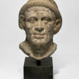 AN ETRUSCAN NENFRO PORTRAIT HEAD OF A MAN - Сейчас на аукционе